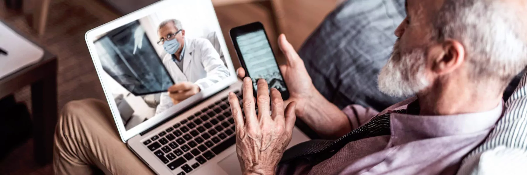 an elderly person looking satisfied using a phone