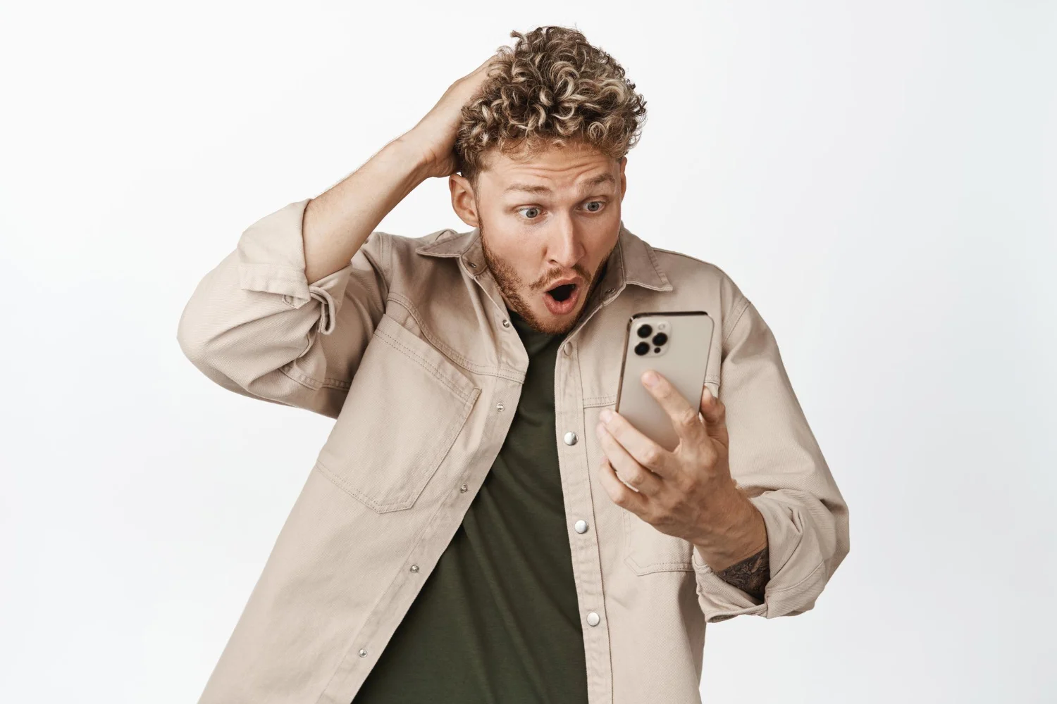Surprised man looking at his phone